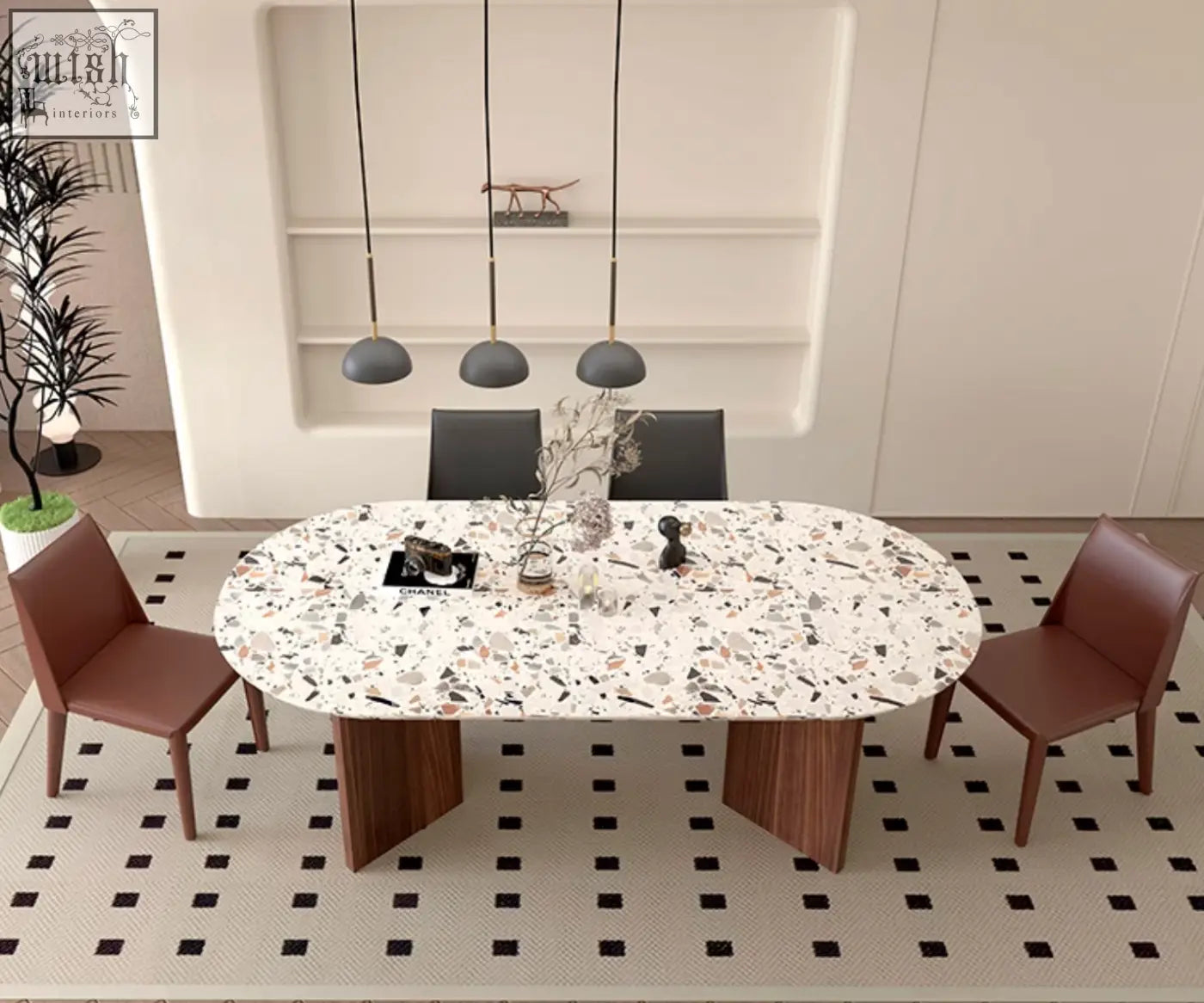 Lynette dining table with a white speckled terrazzo surface and dark wood legs perfect as a stylish dining table