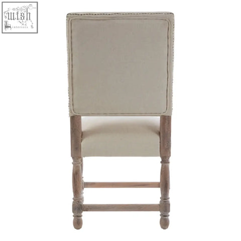 Beige linen dining chair with tufted backrest and oak wood whitewash finish wooden legs