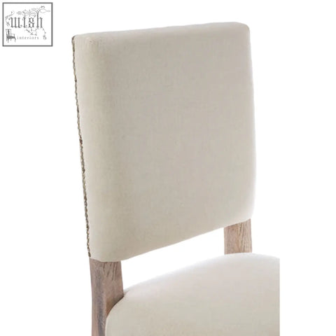 Cream linen dining chair with square backrest and oak wood whitewash finish legs for stylish dining rooms