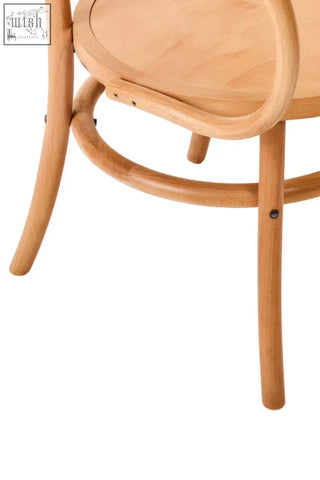 Light-colored lyon natural beech wood dining chair with curved bentwood frame and slender legs
