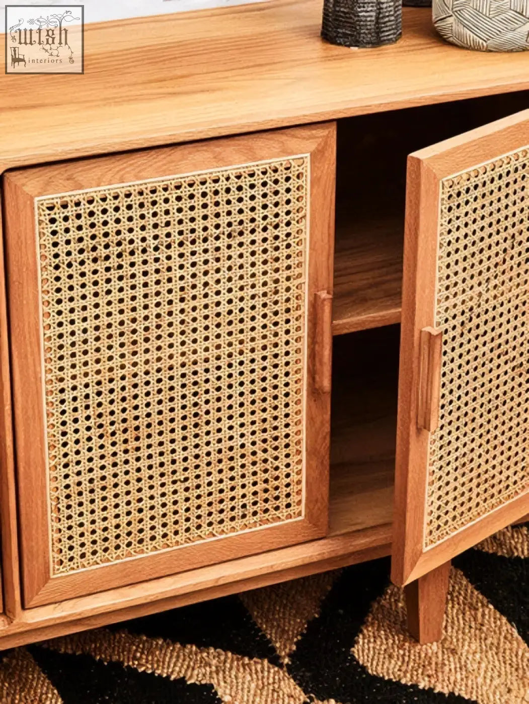A wooden lyon rattan and oak wood door sideboard with woven cane panels and simple rectangular handles
