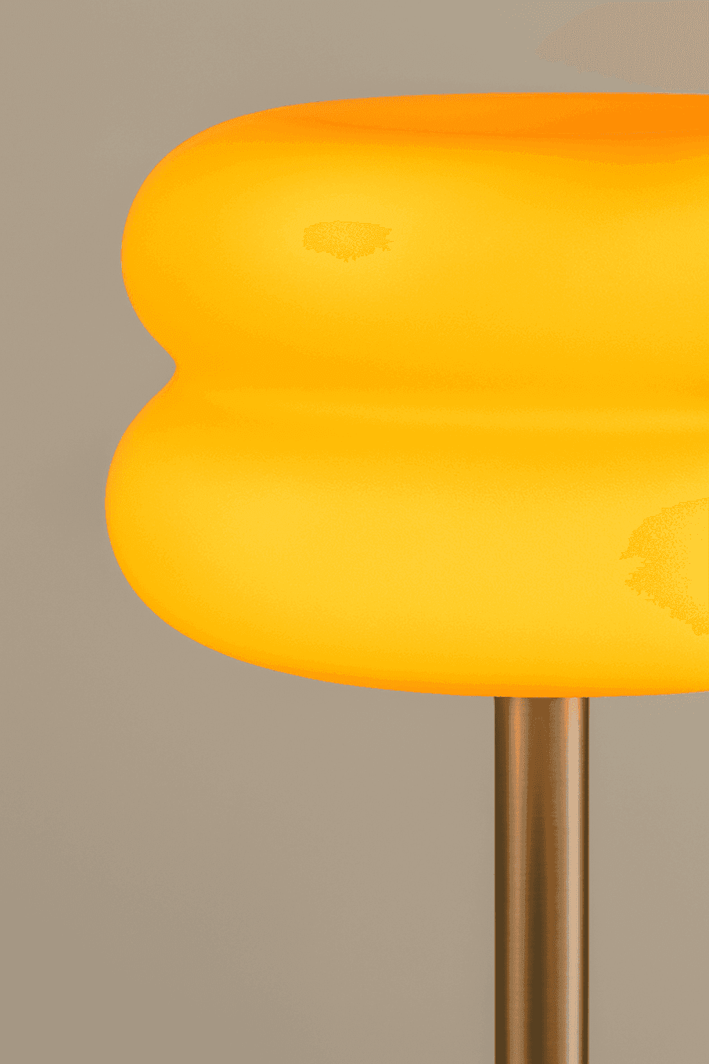 Vibrant yellow smooth glass table lamp with a modern rounded design from the macaron glass table collection