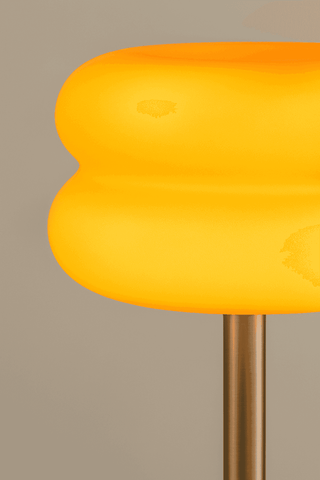 Vibrant yellow smooth glass table lamp with a modern rounded design from the macaron glass table collection
