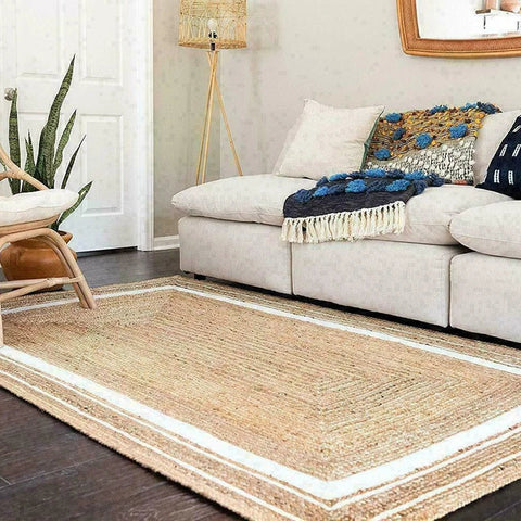 Natural fiber machine rug with beige woven center and white border perfect for cozy home decor