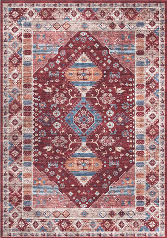 A madar vintage washable rug with a burgundy center and faded blue cream geometric floral patterns