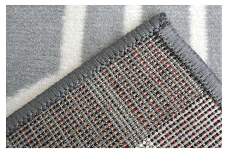 Maestro honeycomb grey rug with woven texture and subtle red accents along the edge for stylish home decor