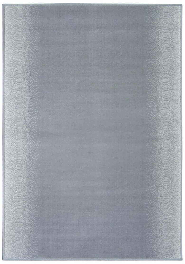 A soft gray rectangular maestro ombre grey rug with subtle gradient and textured border perfect for any room