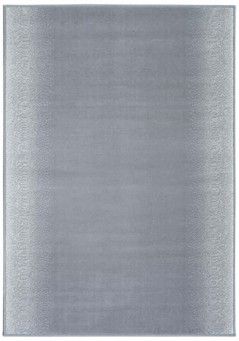 A soft gray rectangular maestro ombre grey rug with subtle gradient and textured border perfect for any room