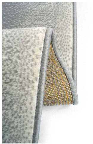 Gray textured maestro ombre grey rug with subtle dotted pattern and yellowish brown woven backing shown from the back