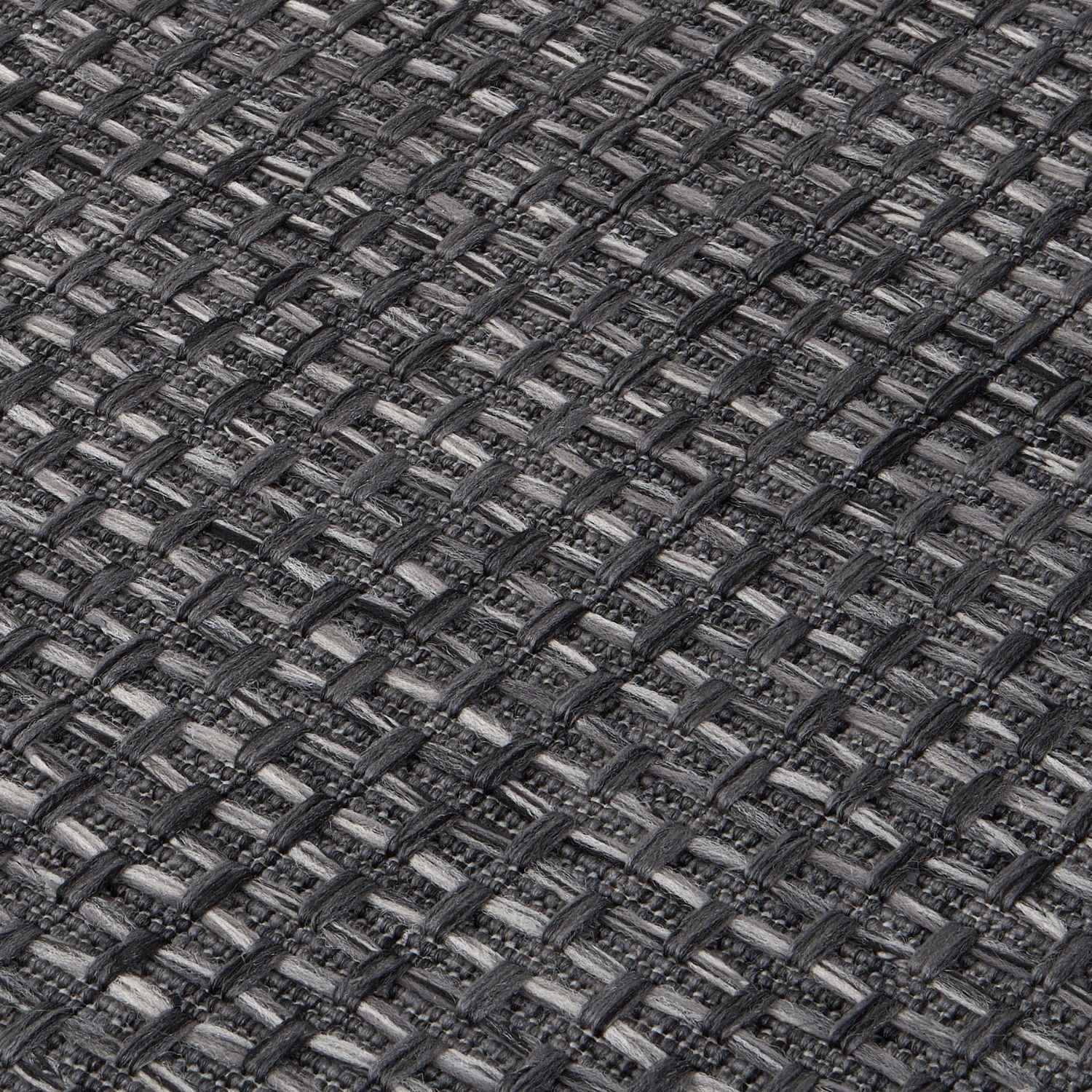 Dark grey magic outdoor rug featuring a textured woven textile with light and dark grey interlaced pattern