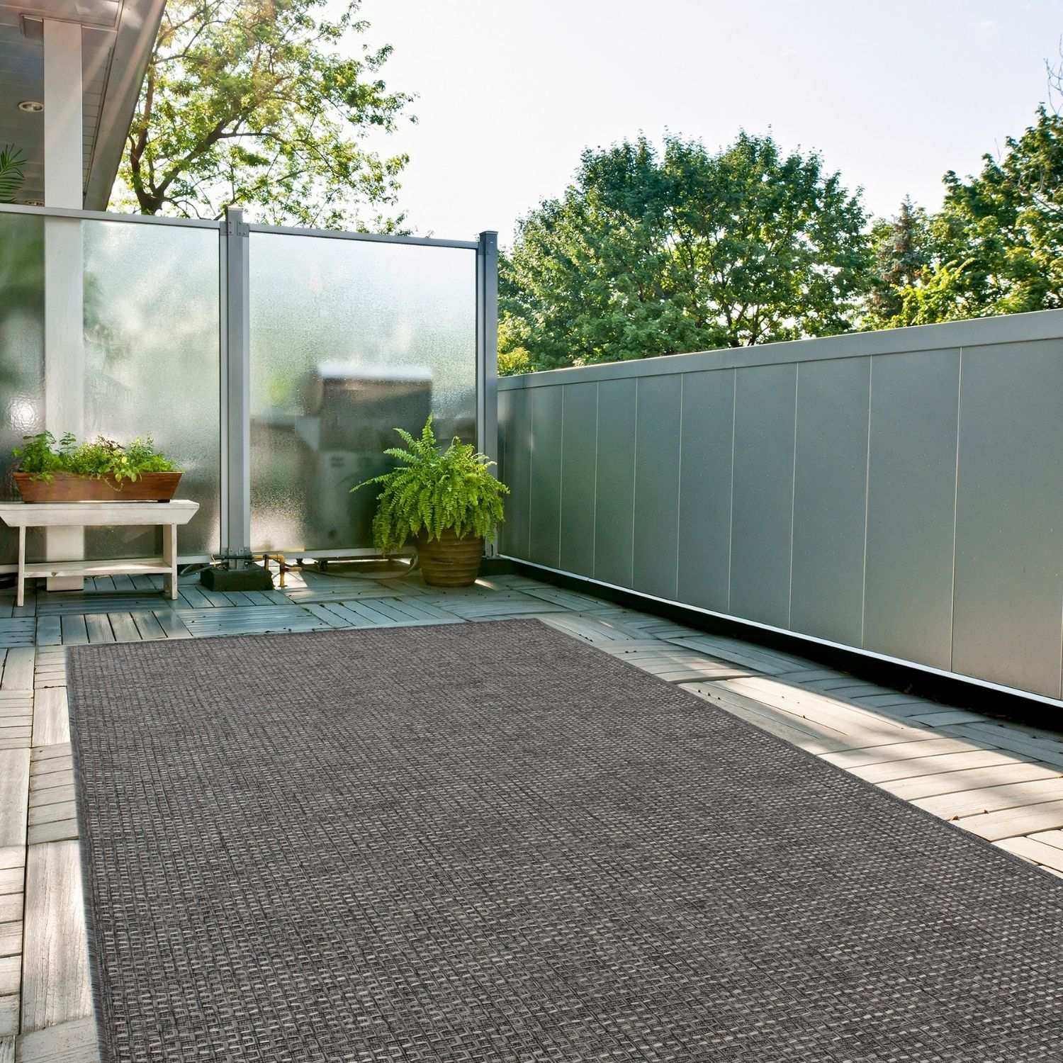 Dark grey woven outdoor rug with textured interlaced pattern from the magic outdoor rug collection 3610DG