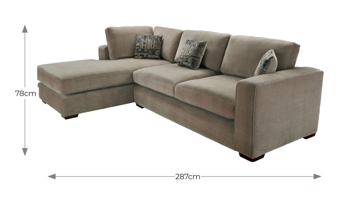 Beige fabric maison corner sofa with three seat cushions chaise lounge and two patterned throw pillows perfect for custom options