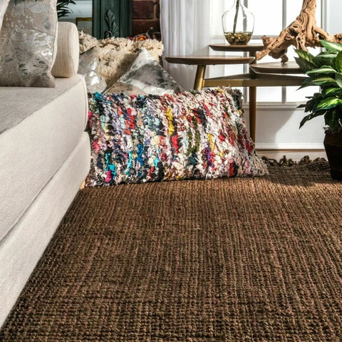 Brown woven jute makasi rug with a textured natural fiber surface perfect for cozy home decor