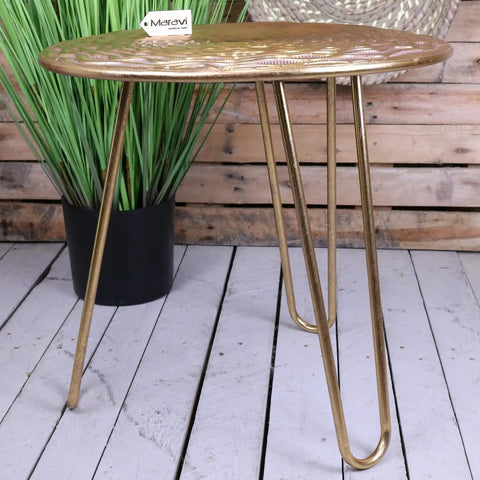 Gold-finished malan gold tripod side table with embossed floral top and sleek metal hairpin legs