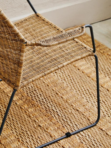 Manado angled design natural rattan chair with woven rattan seat and black metal frame perfect for outdoor use