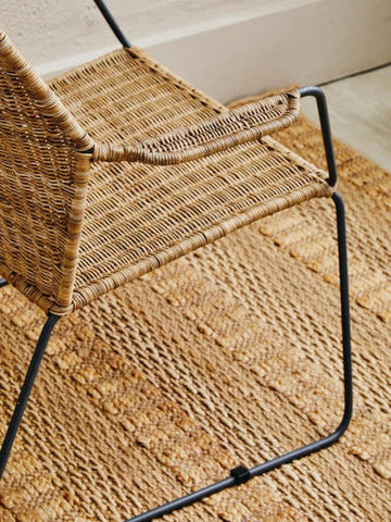Manado angled design natural rattan chair with woven rattan seat and black metal frame perfect for outdoor use
