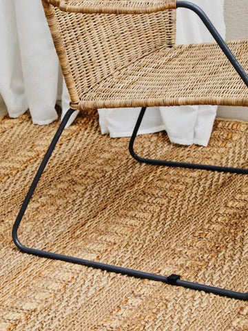 Manado angled design natural rattan chair with woven rattan seat and black metal frame for stylish seating