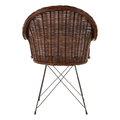 Brown wicker manado natural croco rattan chair with curved backrest and black metal legs perfect for cozy seating