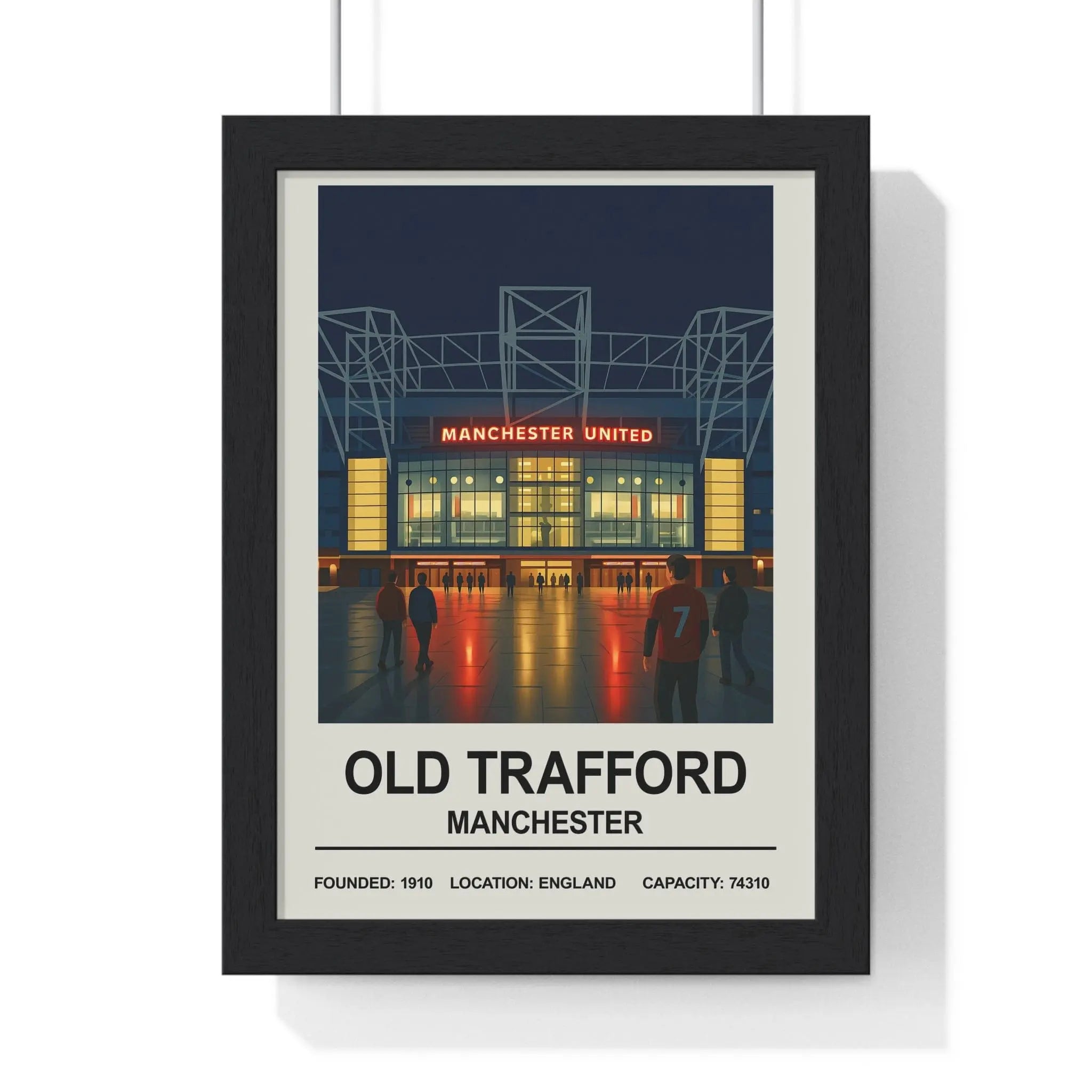 Black-framed manchester old trafford print with nighttime manchester united stadium and red jersey wall art