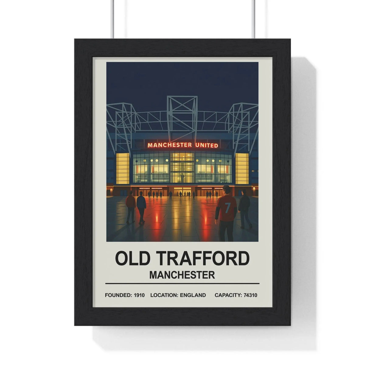 Black-framed manchester old trafford print with nighttime manchester united stadium and red jersey wall art