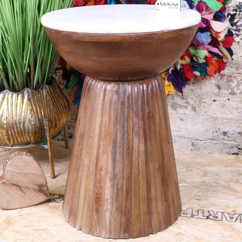 Brown mandawa mango wood side table with white marble top and vertical fluted grooves in rustic finish