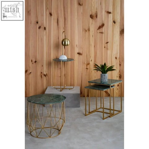 Modern mandoli nest side tables with green marble tops and interconnected gold-toned metal frames