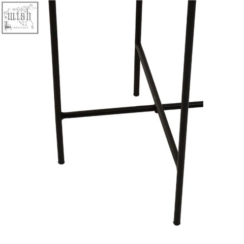 Black metal legs with minimalist iron frame support the mandoli white marble side table top