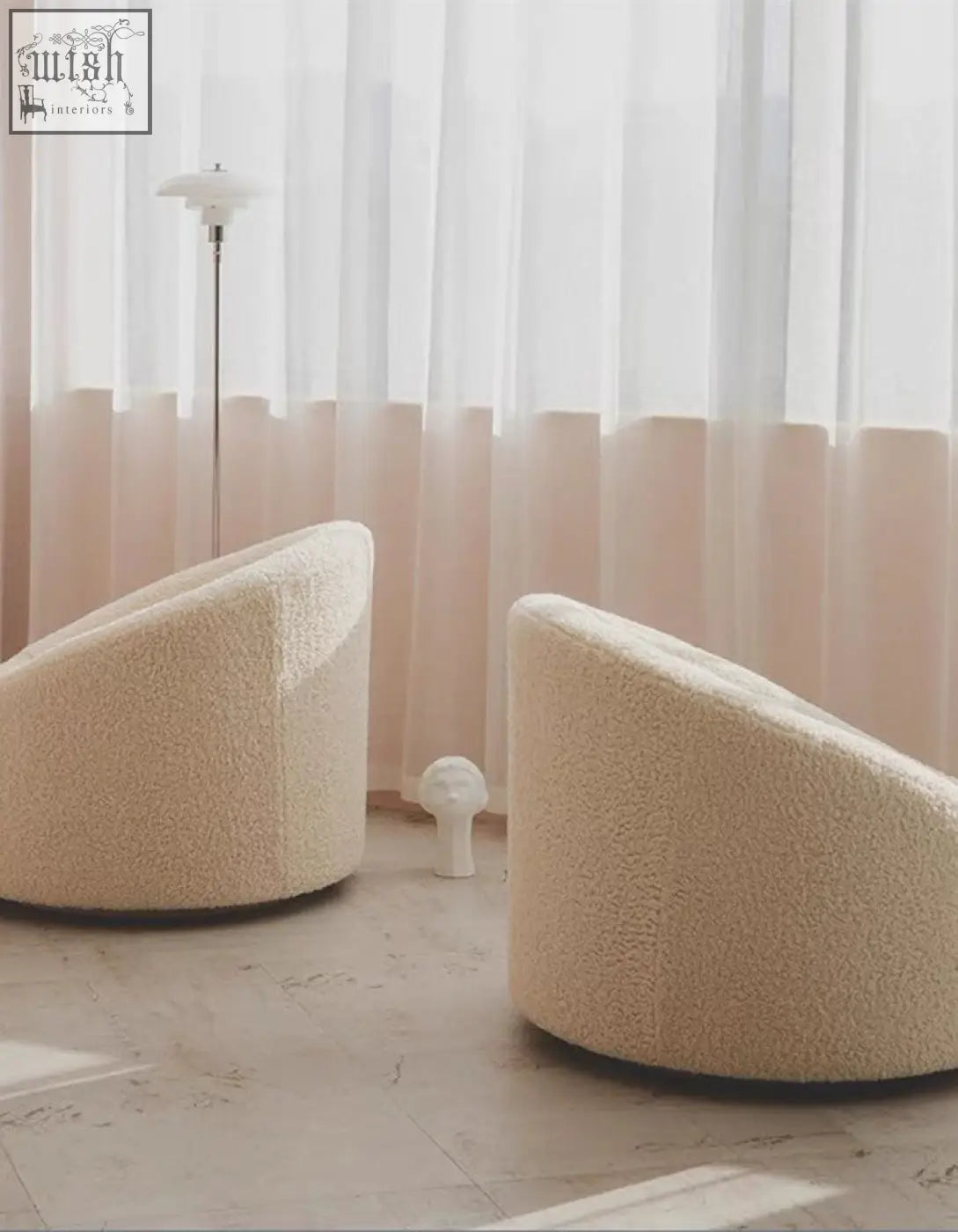 Cream-colored manon armchair with plush rounded design and soft faux fur upholstery perfect for cozy seating