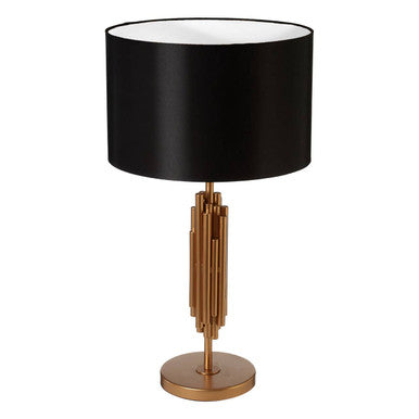 Manor table lamp with black satin drum shade on a gold-toned vertically segmented metal base