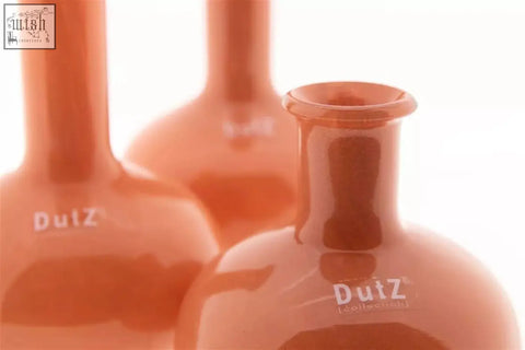 Orange mouth blown glass bottles with glossy finish and dutz logo from manuela vase set dutz collection