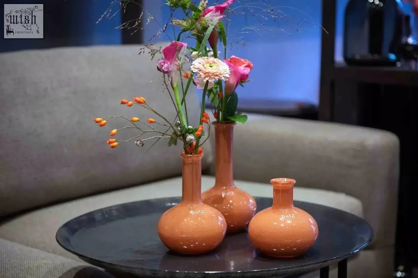Three terracotta mouth blown ceramic vases with rounded bases and slender necks from the dutz manuela vase set