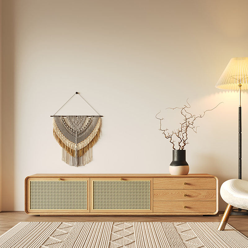 A beige and black ceramic vase with a sleek modern design displayed on the mar tv stand wood unit