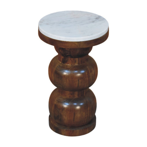 A marble top bulla side table with a round white marble top and dark brown mango wood pedestal base