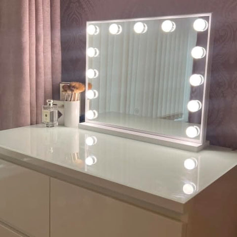 A sleek margot small hollywood mirror 50x42cm with a white frame and circular bulbs for perfect lighting