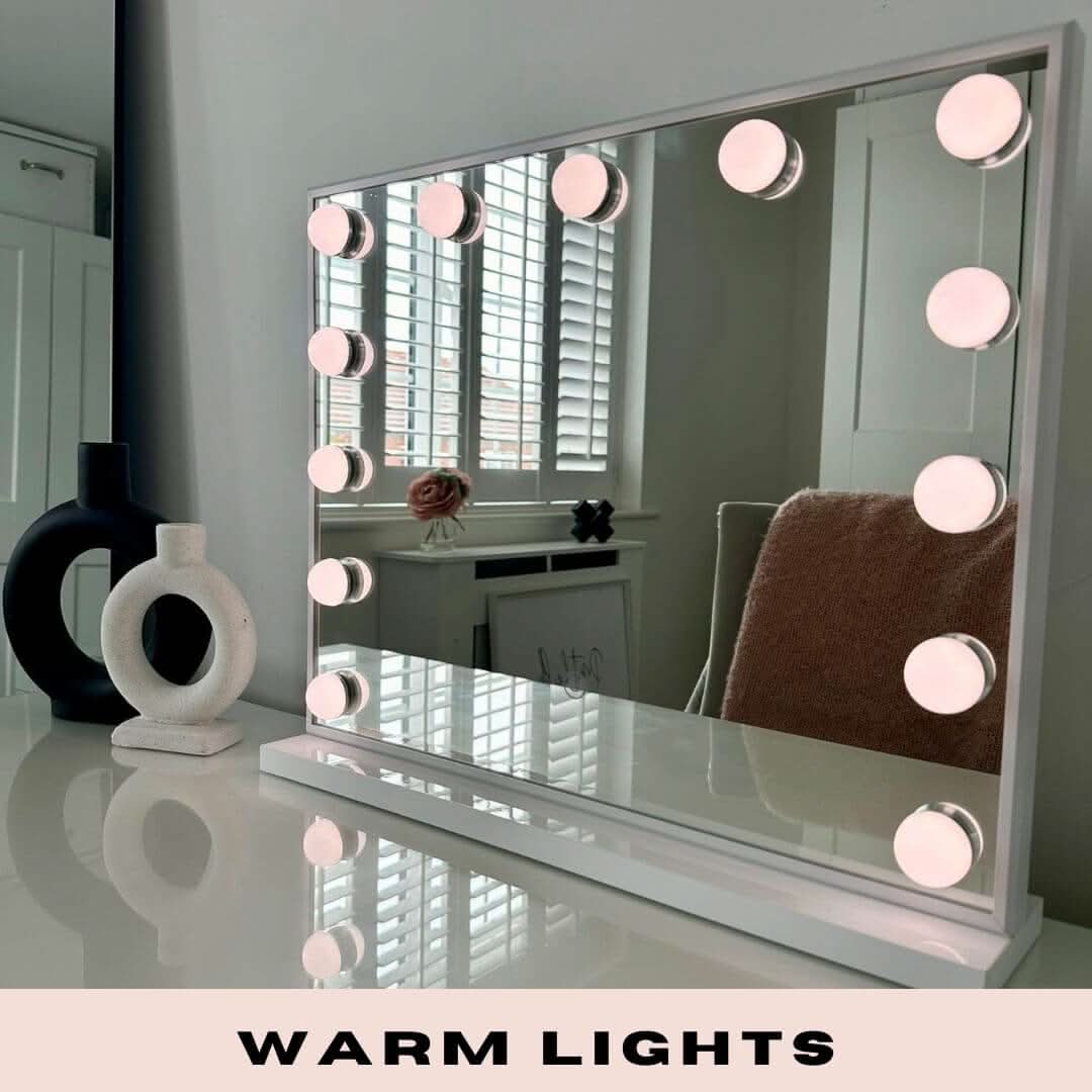 A sleek white margot small hollywood mirror 50x42cm with warm circular lights along its frame perfect for makeup