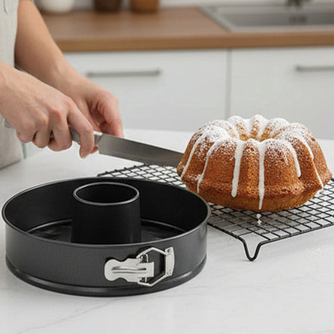 Black Mari non stick round cake pan with silver latch and central tube from cake pan set for easy baking