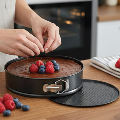 Black mari non stick round cake pan with silver latch and textured base perfect for baking in a cake pan set