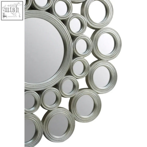 Maris silver wall mirror with silver-toned circular frame and concentric ring design for stylish wall decor