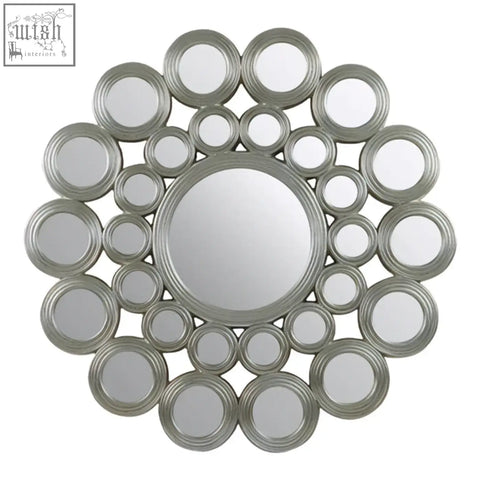 Maris silver wall mirror with silver-toned concentric rings and metallic frame perfect for modern decor