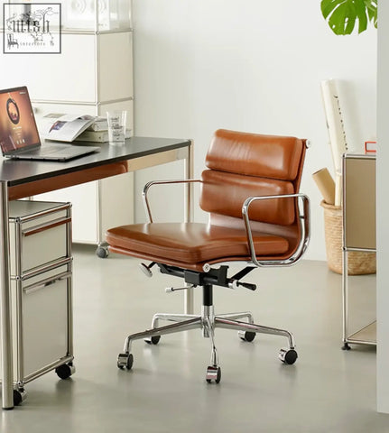 Brown leather office chair with chrome frame and swivel height adjustable features for a stylish office setup