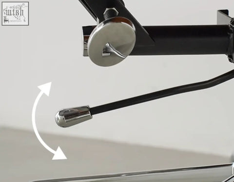 Chrome-finished lever with black handle attached to mounting bracket on marley leather office chair with height adjust
