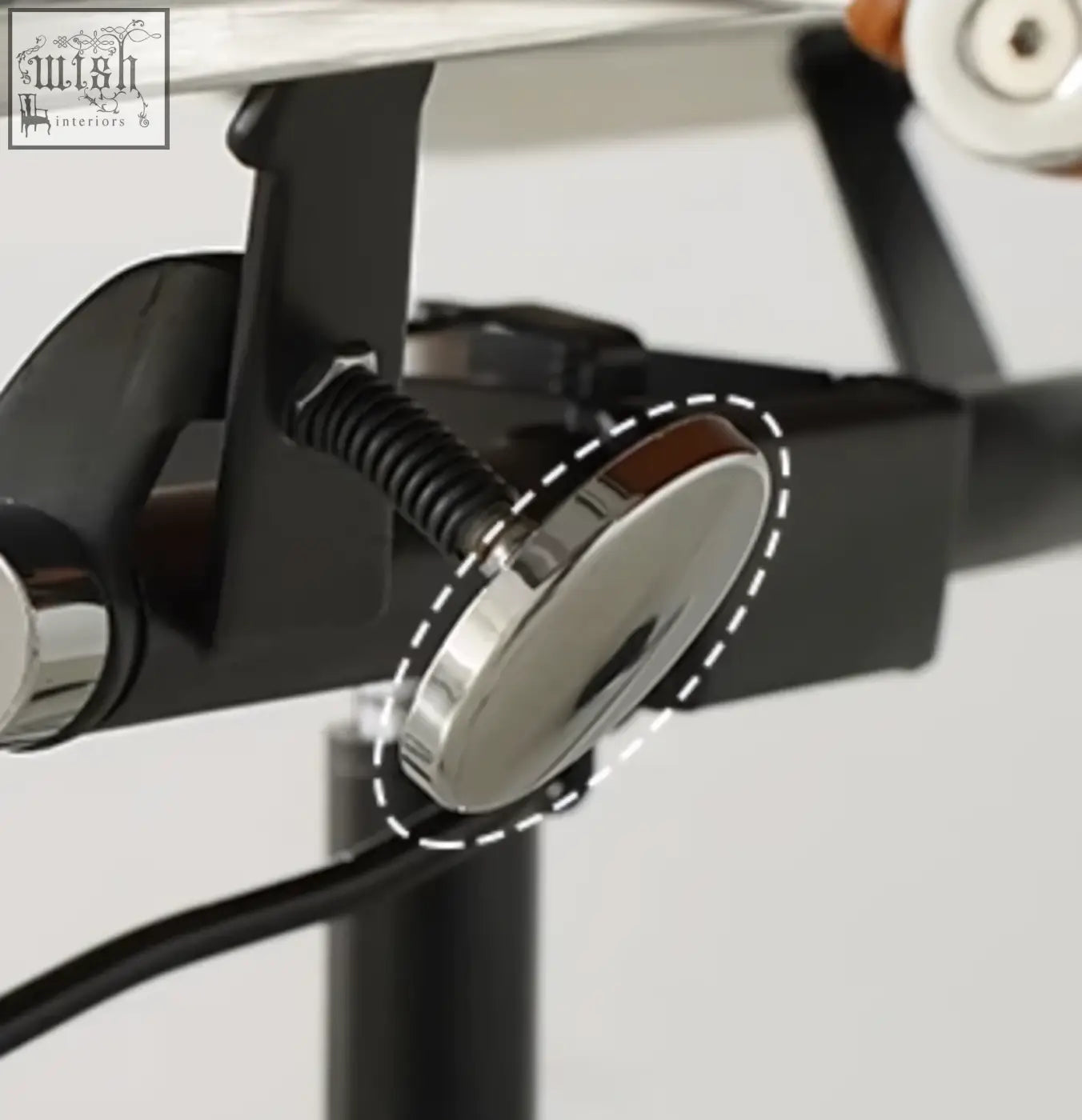 Shiny chrome circular knob with dark brown wooden center on marley office chair with swivel and height adjustable features