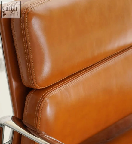 Tan leather office chair with stitched seams and chrome frame Marley office chair with swivel and height adjustable features