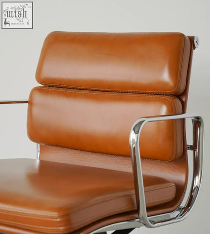 Tan leather office chair with chrome frame and armrests swivel height adjustable for comfortable workspace
