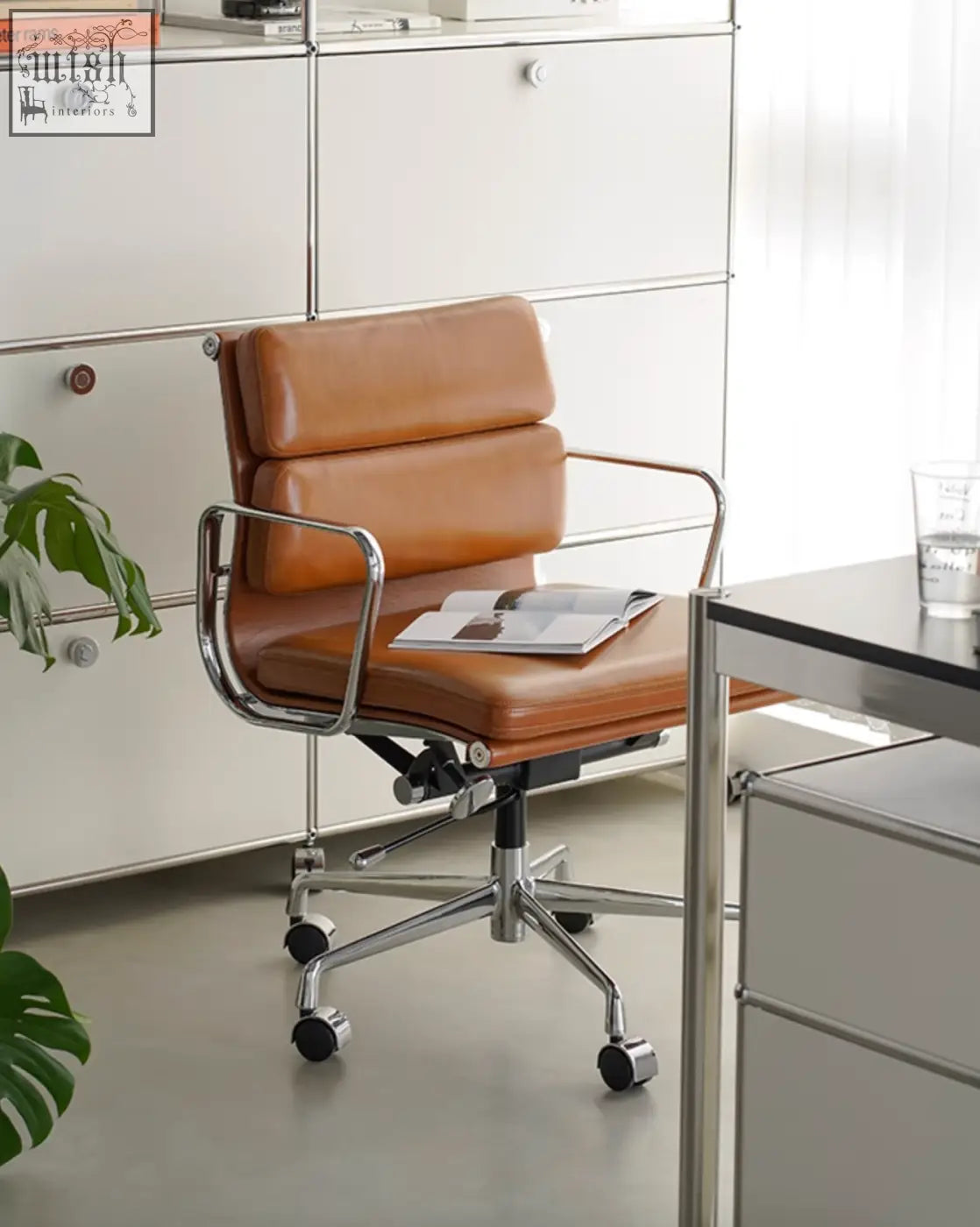 Tan leather office chair with chrome frame and five-wheel base marley office chair with swivel and height adjustable