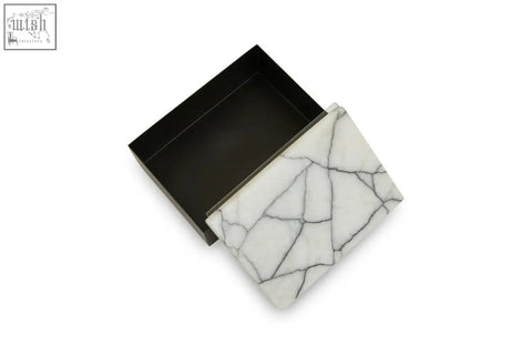 Small marble trinket box made of white marble with black veining and a matte black interior for stylish storage