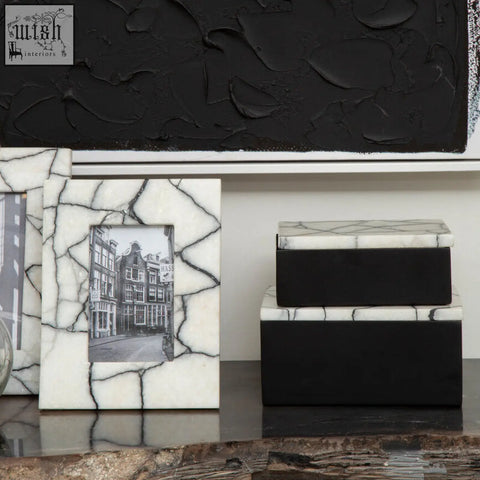 Small marble trinket box with white marble frame black veining crackled texture holding black and white photo