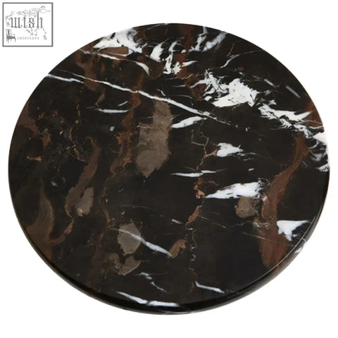 Circular black marble cake stand with swirling white and brown veining perfect for serving marble cake