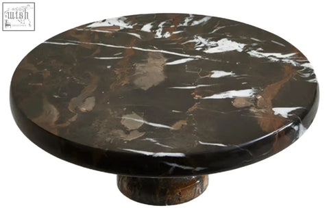 Dark brown marble cake stand with swirling white and copper veining perfect for displaying marble cake