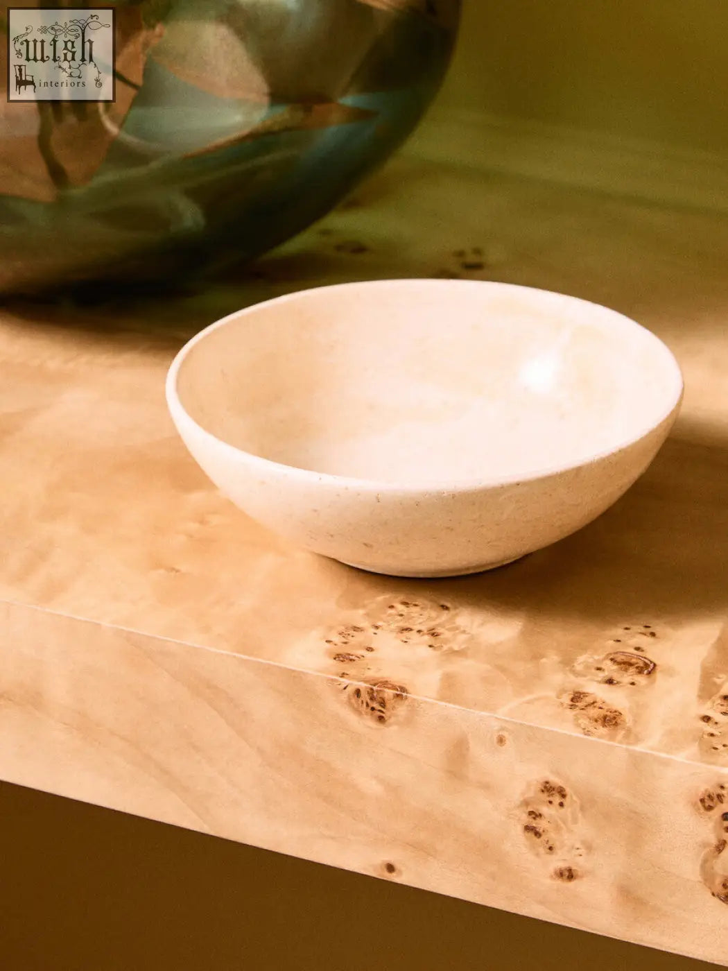 Cream-colored marmore cream marble bowl with smooth speckled surface and rounded edges perfect for serving